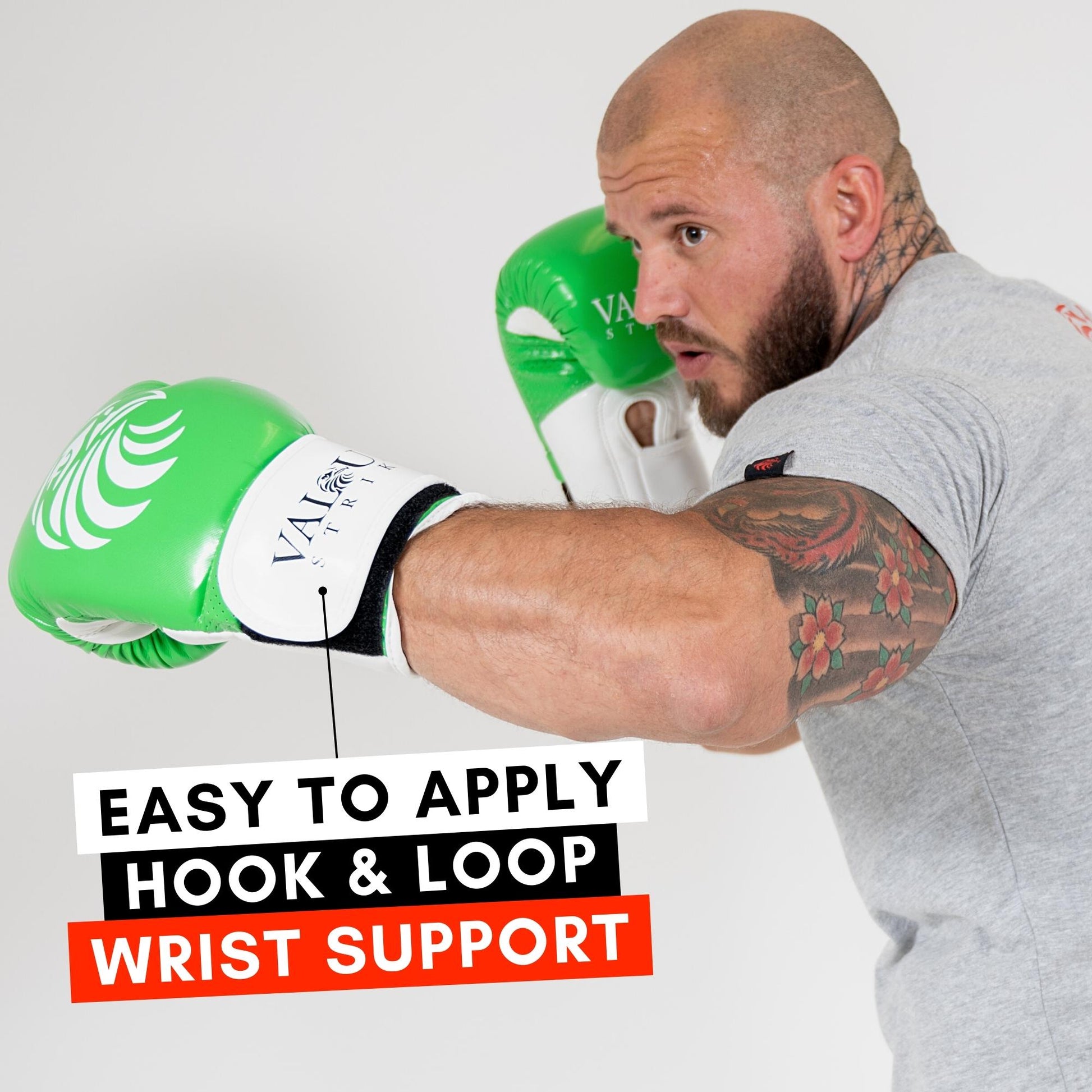 Man in green boxing gloves throwing a hook and using hook and loop wrist support